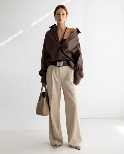 Women's oversized button-up shirt with wide sleeves and relaxed fit