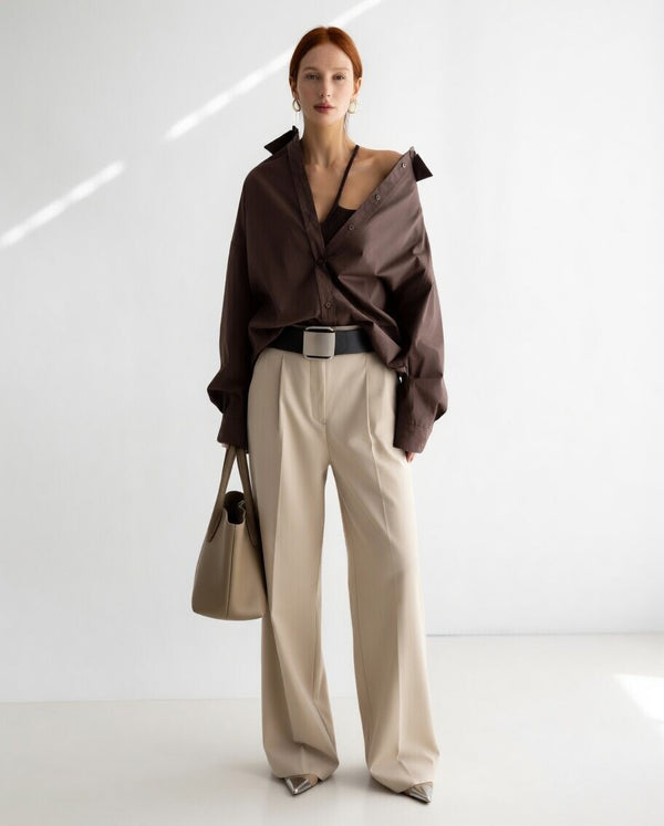 Women's oversized button-up shirt with wide sleeves and relaxed fit